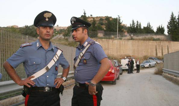 Italian Carabinieri patrol near the entr