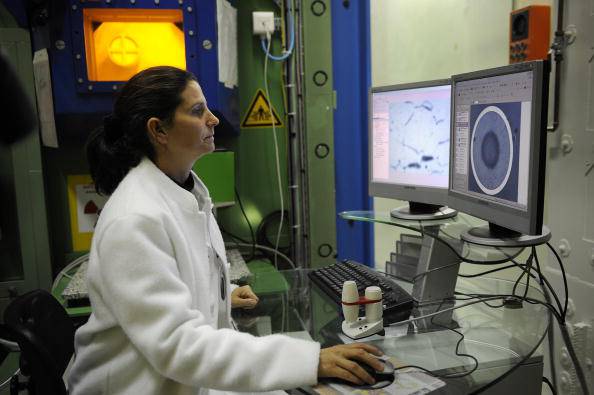 An engineer analyzes radioactive nuclear