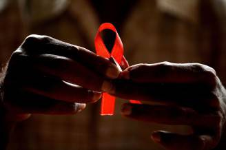 Giornata Mondiale per la lotta all'Aids 2015 (MANJUNATH KIRAN/AFP/Getty Images)