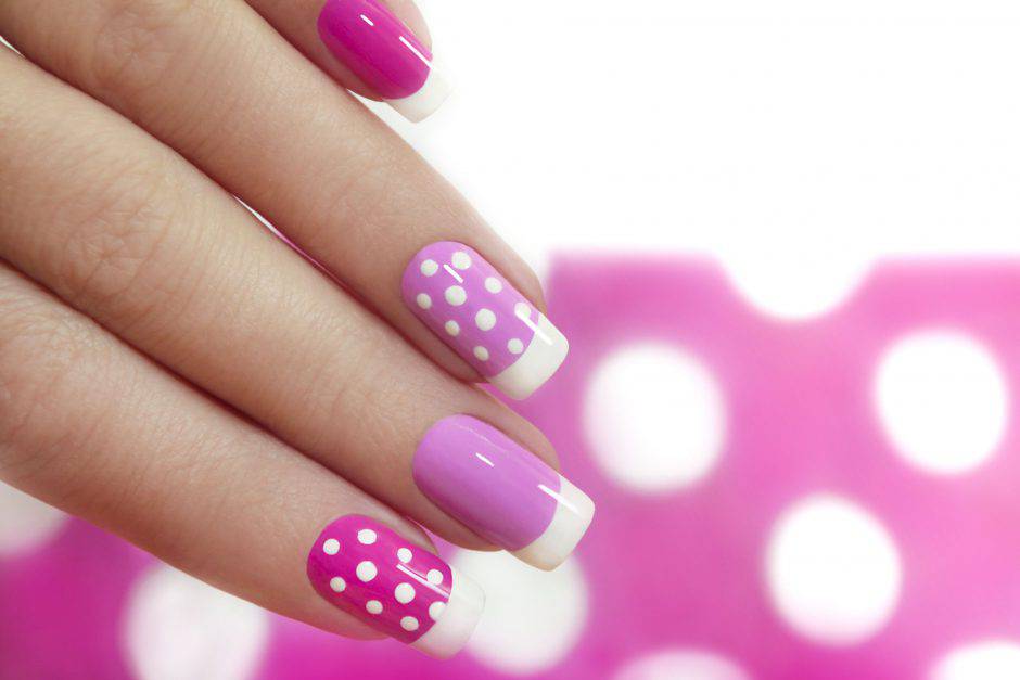 Nail design with white dots on the French manicure with pink varnish of various shades.