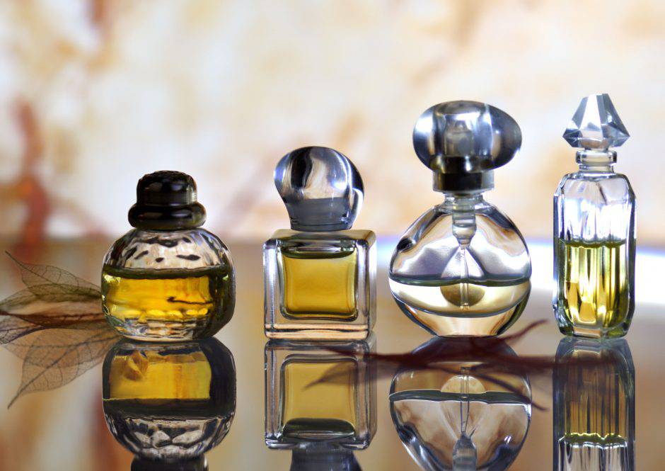 A set of four differently shaped perfume bottles