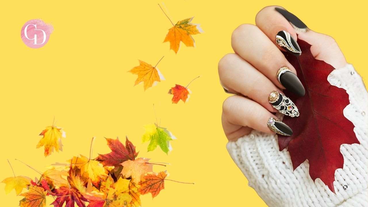 mano di donna con foglie autunnali su sfondo giallo